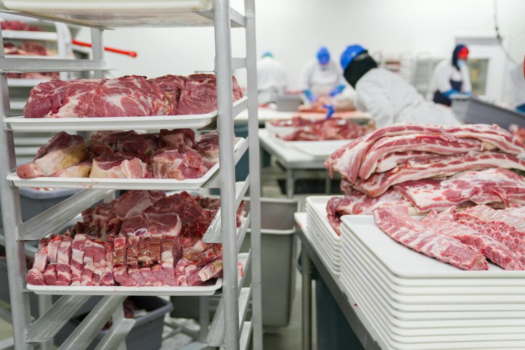Image of meat processing and packaging showcasing coatings for food production