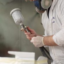 219A2525 A image of someone applying an abrasion resistant coating